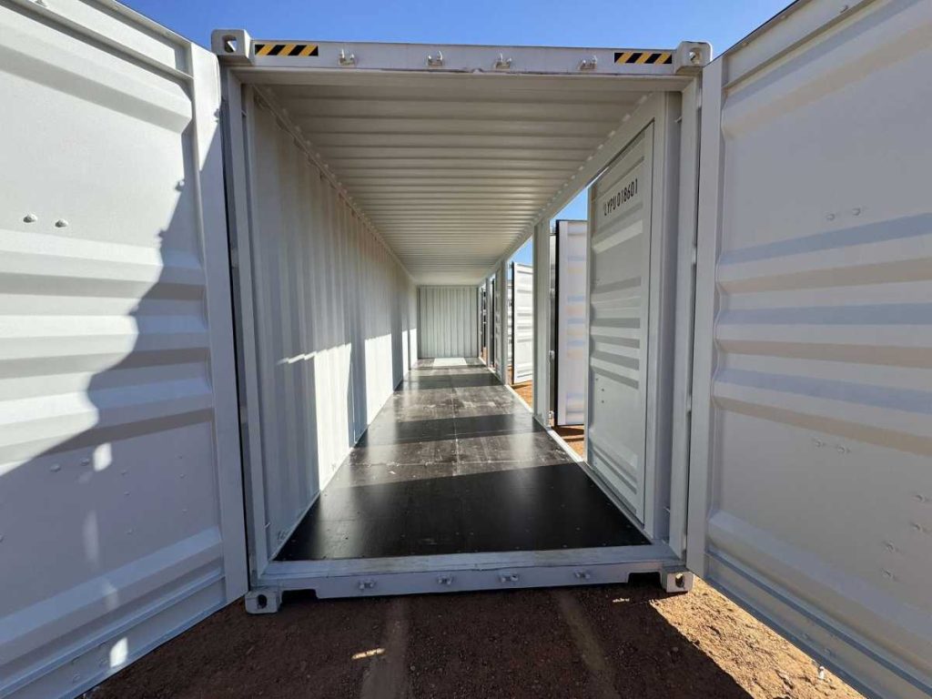 Interior view looking through the open doors of a 40 foot shipping container showing spacious cargo area and corrugated steel walls at Western Truck Sales