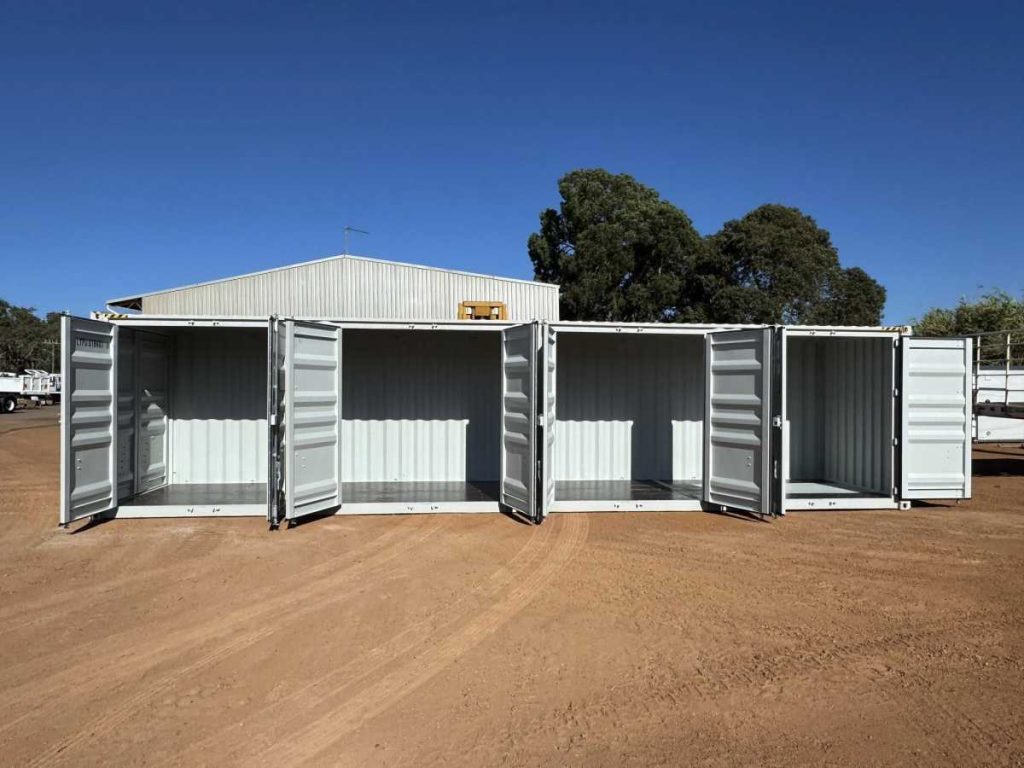 White 40 foot shipping container with side doors open showing accessible storage compartments at Western Truck Sales