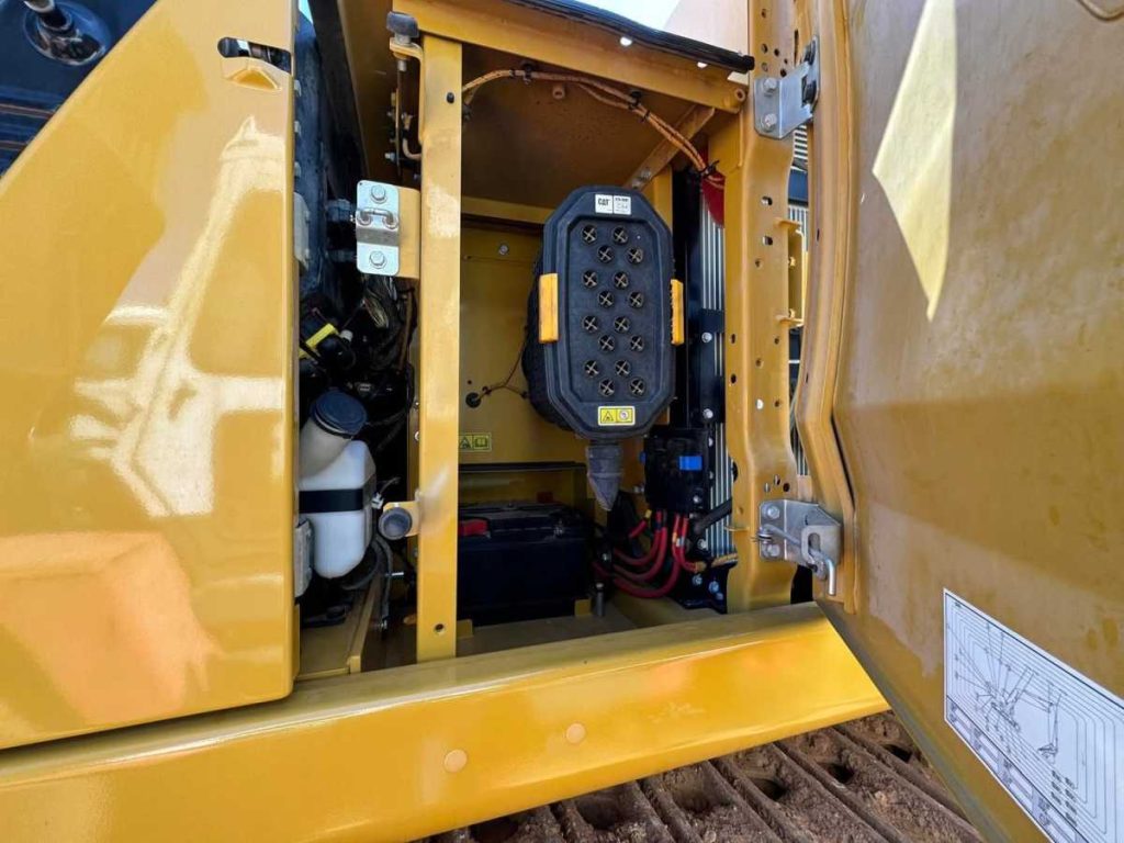 Close up of the undercarriage track frame and boom base on the 2022 Caterpillar 323 Excavator in as-new condition with 1400 hours